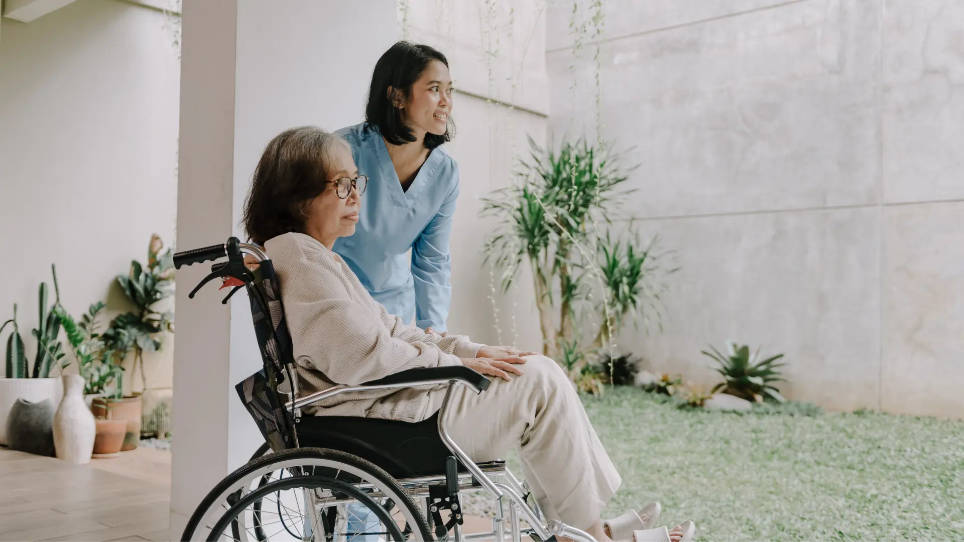 person helping a disabled old lady