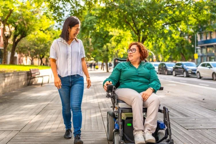 Woman in wheel chair outdoors